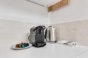 a toaster sitting on a counter in a kitchen at Charming Apartment Gacé II 4P in Gacé
