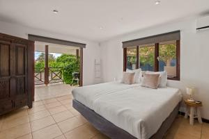 Ένα ή περισσότερα κρεβάτια σε δωμάτιο στο Solaya Villa Curaçao 4 +17 φωτογραφίες
