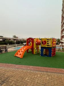 a playground with a slide in a park at apartamento climatizado, 3 quartos c suíte garden in Cuiabá