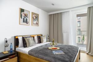 Posteľ alebo postele v izbe v ubytovaní Lumina lux apartment on Drewnowska