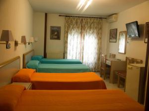 Un pat sau paturi într-o cameră la Lizana 2