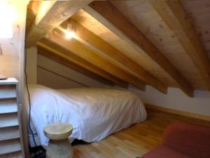 Łóżko lub łóżka w pokoju w obiekcie Superbe T4 mansardé - 3 chambres - Vue panoramique - Parking privé - FR-1-629-112