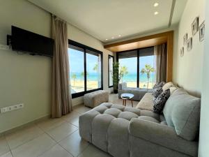 TV a/nebo společenská místnost v ubytování Seaside Apartments