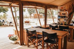a wooden table and chairs in a house at Luna del Monte in Monte Santa Maria Tiberina