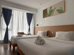 Postel nebo postele na pokoji v ubytování Fun Hotel