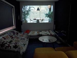 Łóżko lub łóżka w pokoju w obiekcie Holiday Home near Dongdaemun Myeongdong