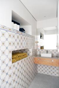 a kitchen with a counter and a sink in a room at Casa do Vale das Furnas in Furnas +23 photos