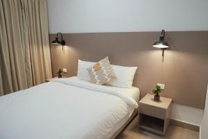Tempat tidur dalam kamar di H4 LAS CABAÑAS