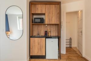 Køkken eller tekøkken på Studio équipé proche centre-ville et métro + 3 billeder