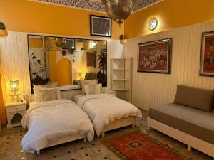 Postel nebo postele na pokoji v ubytování Riad Noos Noos & Spa