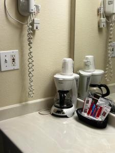 a coffee maker on a counter in a bathroom at Ameristay Inn & Suites in Waverly