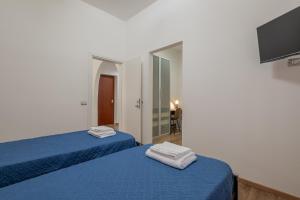 Postel nebo postele na pokoji v ubytování LE TRE M - Guesthouse