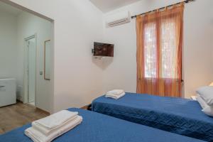 Postel nebo postele na pokoji v ubytování LE TRE M - Guesthouse
