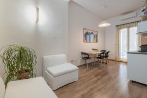 Kuchyň nebo kuchyňský kout v ubytování LE TRE M - Guesthouse