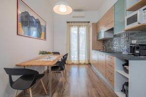 Kuchyň nebo kuchyňský kout v ubytování LE TRE M - Guesthouse