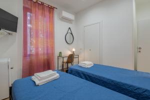Postel nebo postele na pokoji v ubytování LE TRE M - Guesthouse