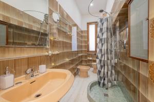 Koupelna v ubytování LE TRE M - Guesthouse