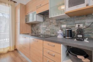 Kuchyň nebo kuchyňský kout v ubytování LE TRE M - Guesthouse