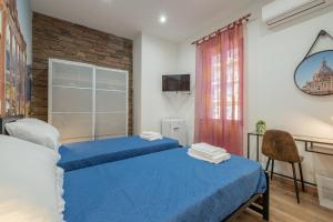 Postel nebo postele na pokoji v ubytování LE TRE M - Guesthouse
