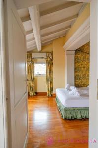 a bedroom with a bed and a window and a door at Le Belle Époque in Parma +30 photos