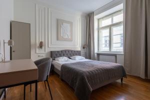 Postel nebo postele na pokoji v ubytování Old Town - Hall Square Apartment