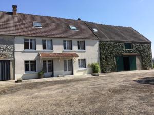 a large house with a large driveway in front of it at La Ferrière in Marolles-en-Brie