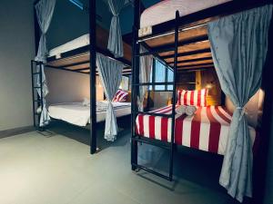 a bedroom with two bunk beds in a house at Por Chey in Battambang +111 photos