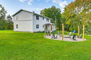 a playground in a yard with a building at Lakefront Wisconsin Getaway Fish, Boat, Relax! in Birnamwood