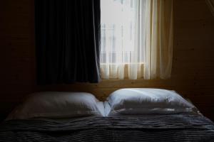 Letto o letti in una camera di UnderHill Kazbegi