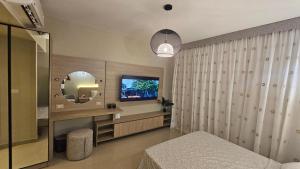 TV a/nebo společenská místnost v ubytování G Cribs Stylish Studio