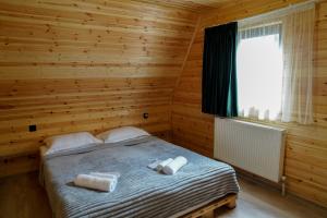 Letto o letti in una camera di UnderHill Kazbegi