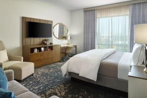 a hotel room with a bed and a television at The Westin Memphis Beale Street in Memphis +28 photos