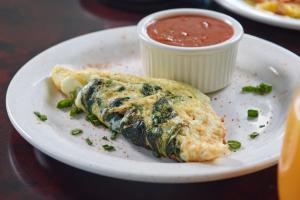 a white plate with a piece of food and sauce at The Westin Memphis Beale Street in Memphis