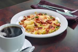 a plate of food and a cup of coffee on a table at The Westin Memphis Beale Street in Memphis
