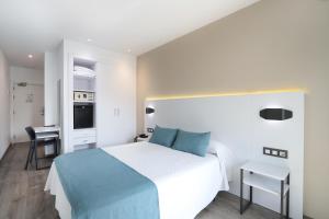 Postel nebo postele na pokoji v ubytování Hotel Alameda