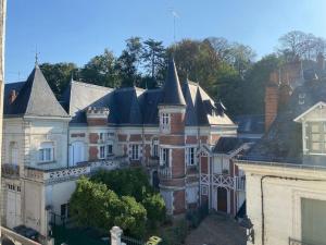 an aerial view of a large house with turrets at Duplex cinéma - centre historique Tours in Tours