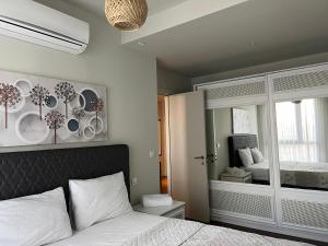 a bedroom with a bed with plates on the wall at huzurlu ve şirin in Istanbul +23 photos