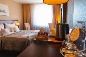 Postel nebo postele na pokoji v ubytování PREMIUM Business Hotel Bratislava