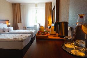 Postel nebo postele na pokoji v ubytování PREMIUM Business Hotel Bratislava