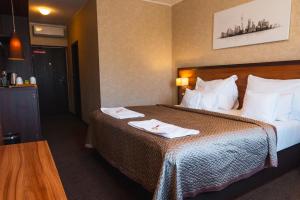 Postel nebo postele na pokoji v ubytování PREMIUM Business Hotel Bratislava