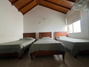 Postel nebo postele na pokoji v ubytování Hotel el Recuerdo