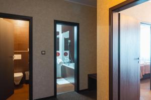 Postel nebo postele na pokoji v ubytování PREMIUM Business Hotel Bratislava