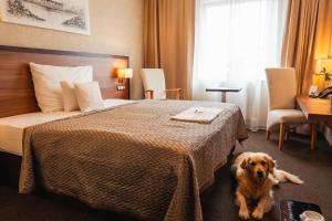 Postel nebo postele na pokoji v ubytování PREMIUM Business Hotel Bratislava