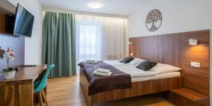 Postel nebo postele na pokoji v ubytování WX Hotel