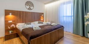 Postel nebo postele na pokoji v ubytování WX Hotel