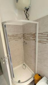 a shower stall in a bathroom with at La Dolce Vita in Fiumicino