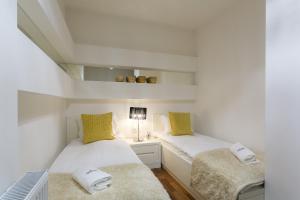 Posteľ alebo postele v izbe v ubytovaní VIP Apartamenty Gorące Źródła