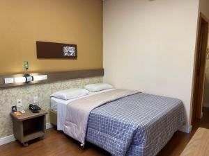Postel nebo postele na pokoji v ubytování Hotel 10 Blumenau