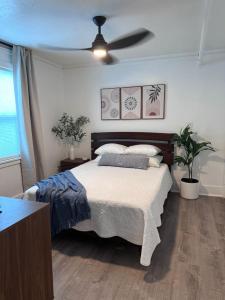 a bedroom with a bed and a ceiling fan at Modern Unit 313 at The George in Klamath Falls