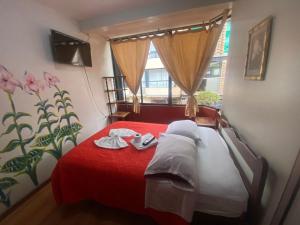 Postel nebo postele na pokoji v ubytování Andes Hostal + 37 fotografií